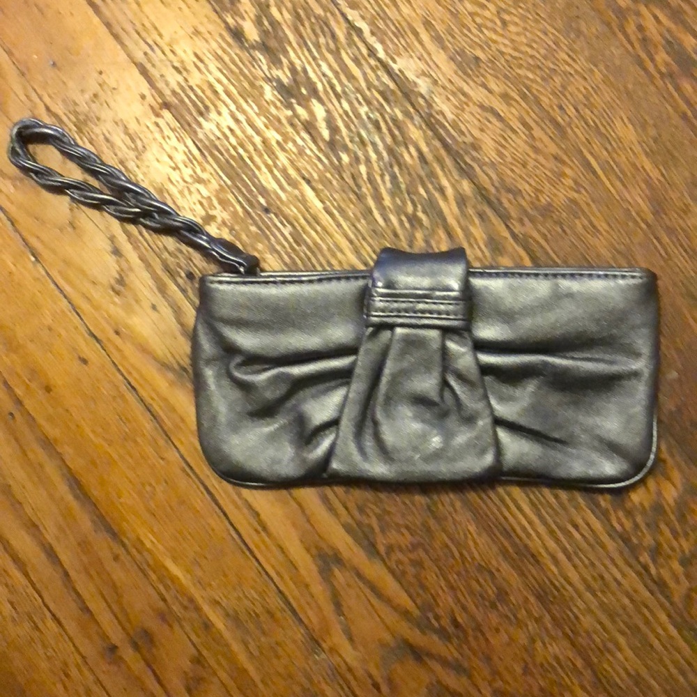 Silver clutch with bow and braided strap